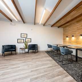 A conference room with a long table and chairs.