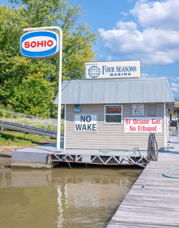 a gas station with a no wake sign on a dock