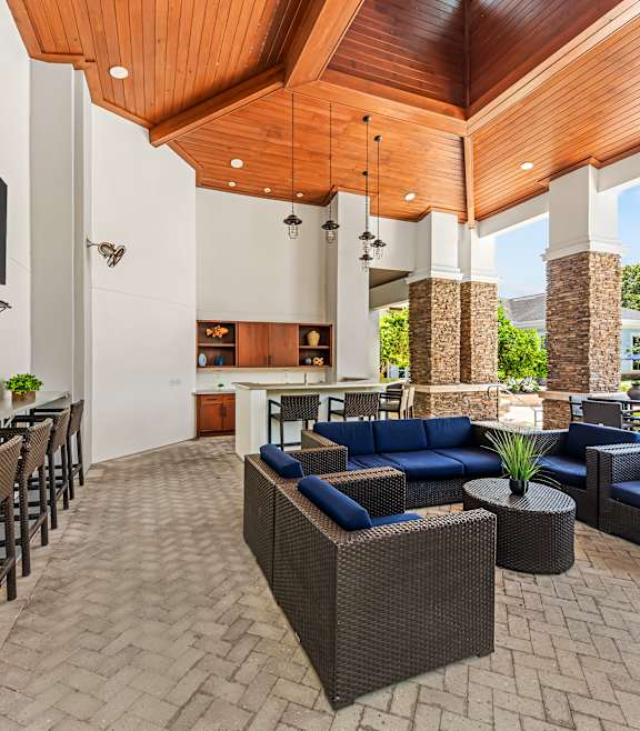 a living room with couches and chairs and a rug at Village at Terra Bella Apartments, Land O' Lakes, Florida