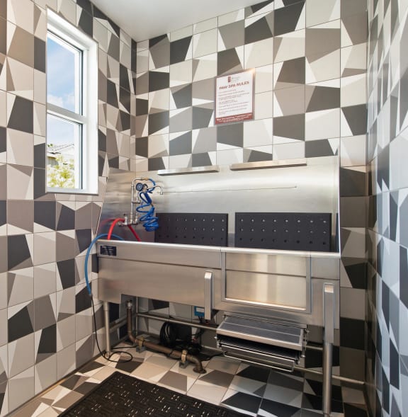 a kitchen with a stove and tiles on the wall at Morgan Ranch Apartments, California, 95037