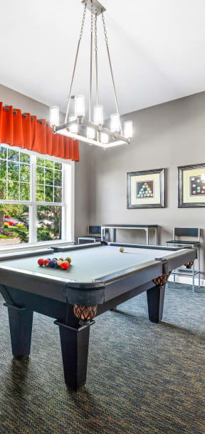 play a game of pool in the game room of your home