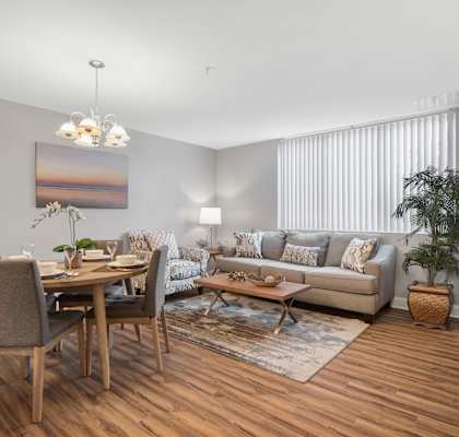 A modern living room with a dining table and a couch.