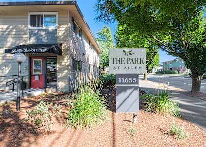 the park at allen sign in front of a building