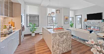 A modern kitchen with a large island in the middle.