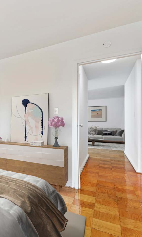 A bedroom with a bed in the center and a painting on the wall.