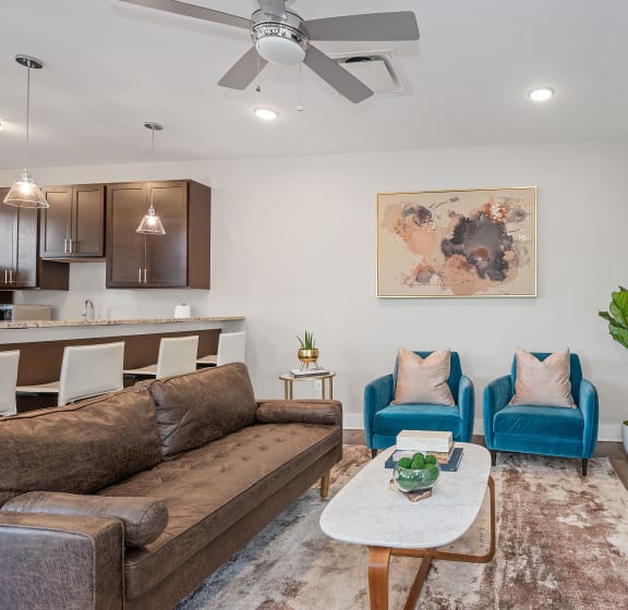 a living room with a couch and two chairs and a fireplace at DeSales Flats Apartments*, Cincinnati, 45206