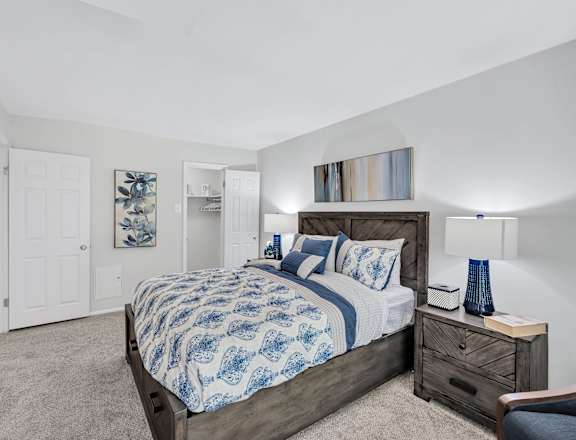 a bedroom with a bed and two night stands