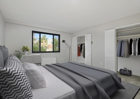 A bedroom with a large bed and a wardrobe at Earle Manor Apartments, Wheaton, MD 20902