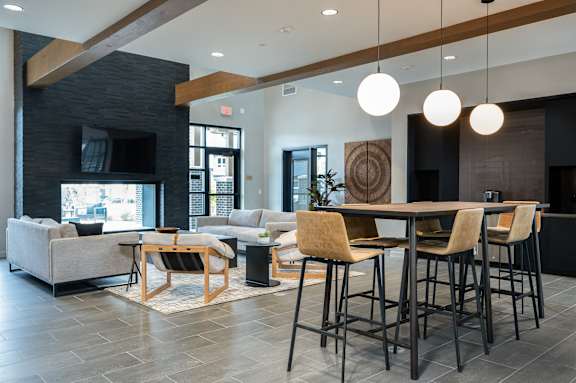 a living room with a bar and couches and a television