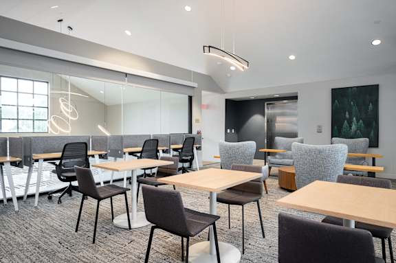 a large dining room with tables and chairs