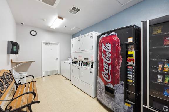 a snack room with vending machines and a coke machine