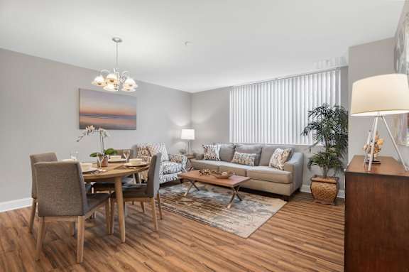A modern living room with a dining table and a couch.