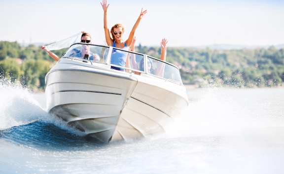 A group of people are enjoying a boat ride on a sunny day.