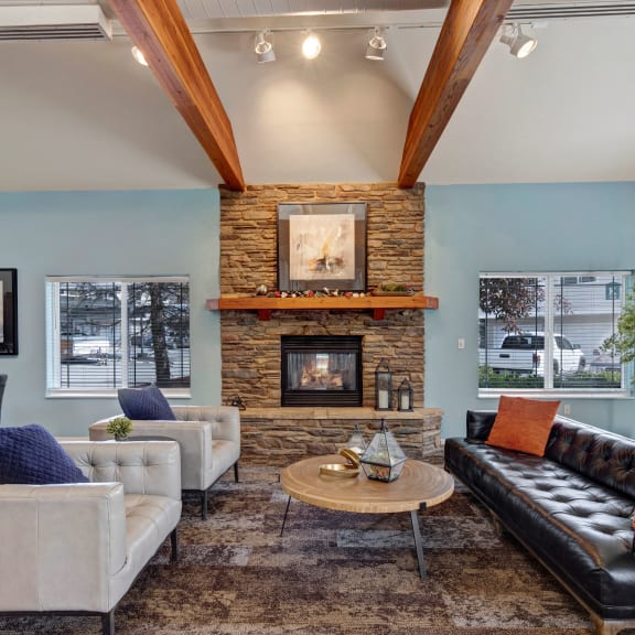a spacious living room with a vaulted ceiling and exposed beams