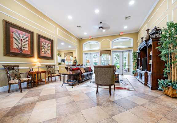 A living room with a checkered floor and a fireplace.