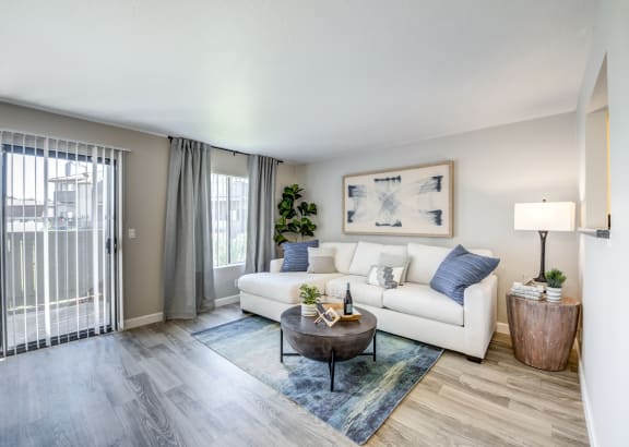 an open living room with a couch and a coffee table