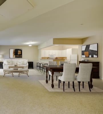 a living room and dining room with white furniture and beige carpet