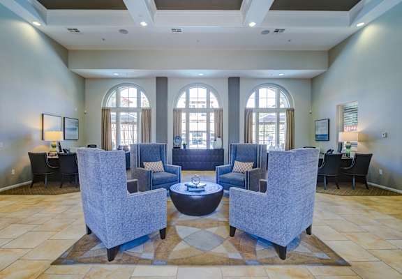 Lobby with a circular table in the middle and chairs surrounding it at Sonoma at Porter Ranch, CA, 91326