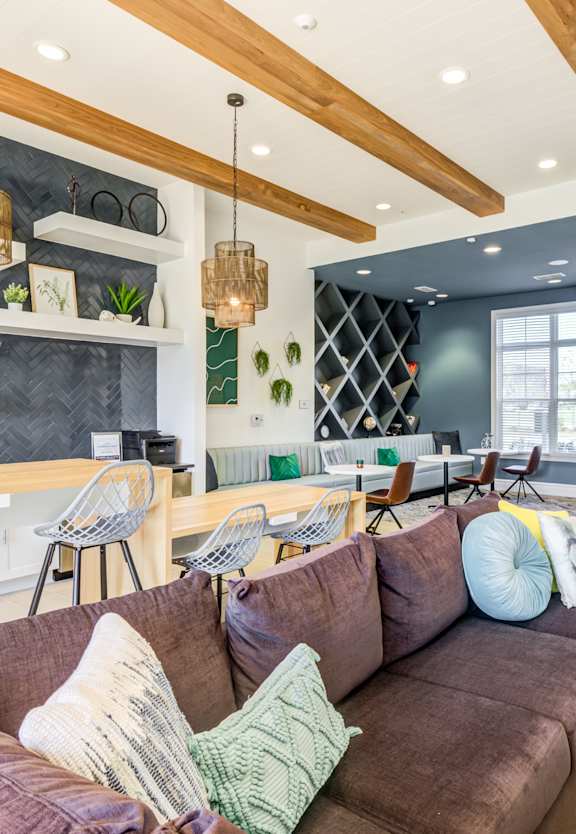 a living room with a couch and chairs