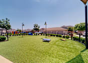 Thumbnail 3 of 5 - A park with a bench and a baseball diamond.