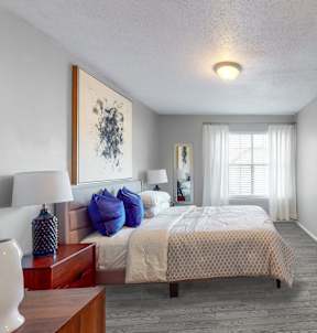 a bedroom with a large bed and a white door