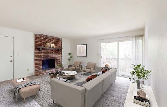 a living room with a white couch and a brick fireplace