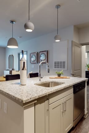 a kitchen with an island and a living room Matthews, NC 28105
