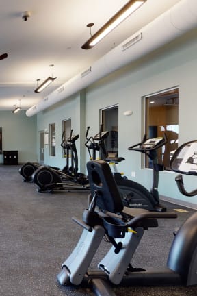 a gym with weights and other exercise equipment and windows Matthews, NC 28105