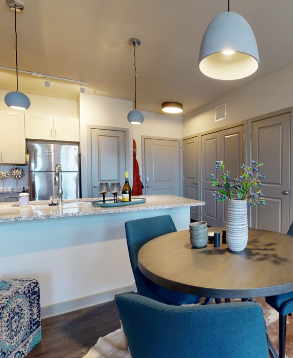 a kitchen and dining room with a table and chairs Matthews, NC 28105