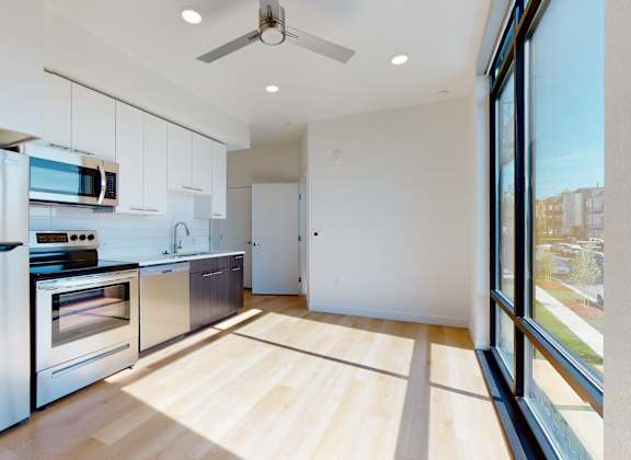 Kitchen with Wooden Floor at Proto Apartments, Denver, Colorado