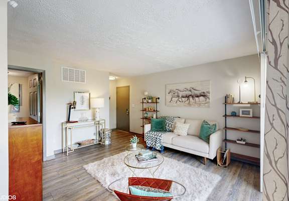 a living room with a couch and a table at Runaway Bay Apartments, Columbus, 43204