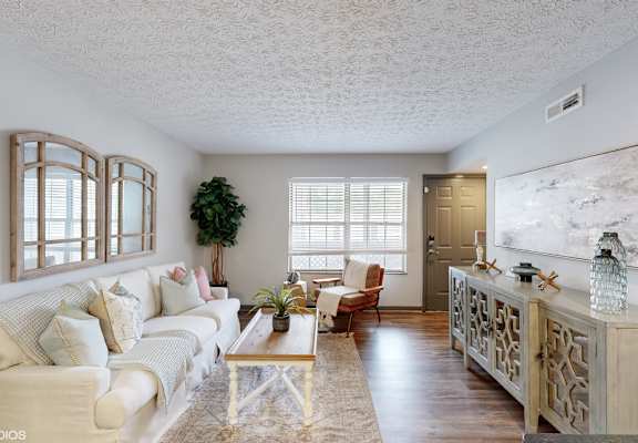 a living room with a couch and a table at Island Club Apartments, Columbus, 43235
