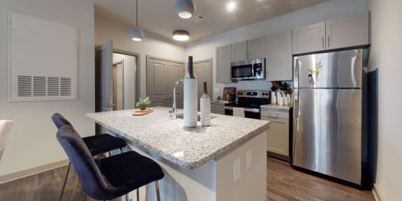 a kitchen with stainless steel appliances and a granite counter top Matthews, NC 28105