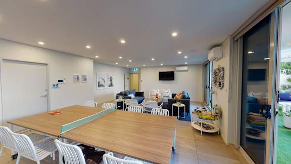 a dining room and living room with a table and chairs