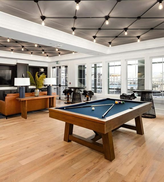 Playful game room with pool table and skee-ball machine at Novel Harpeth Heights
