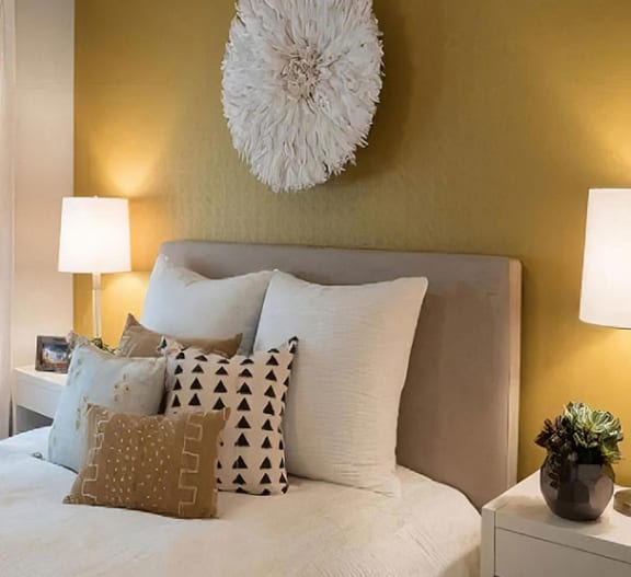 a room full of plants and hanging pots on a wall at Amerige Pointe, Fullerton