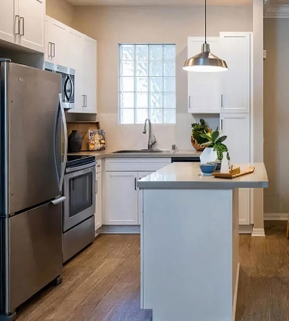 Island Kitchen with Breakfast Bar at Amerige Pointe, California, 92833