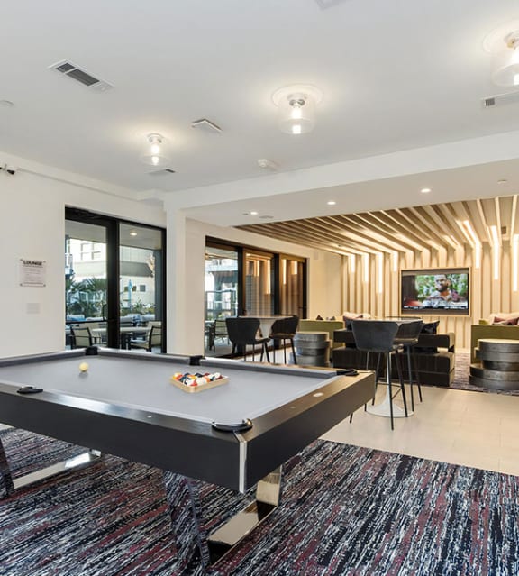 a living room with a pool table