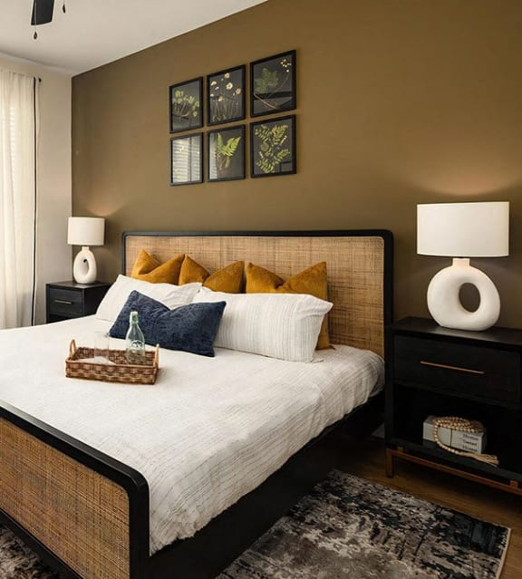 Sophisticated bedroom with caramel-colored feature wall at Novel Harpeth Heights