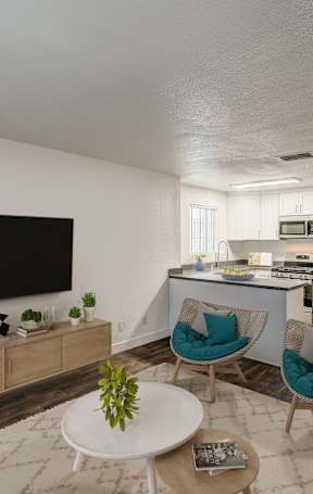 A living room with a television, a dining table, and chairs.