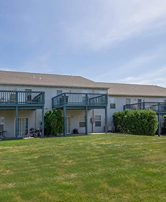 a row of three story houses on a street
