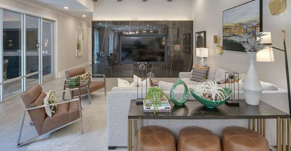 A modern living room with a fireplace and a dining table.