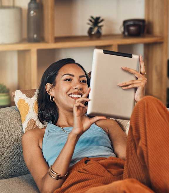 A woman sitting on a couch at Fieldpointe of Schaumburg, IL, 60173
