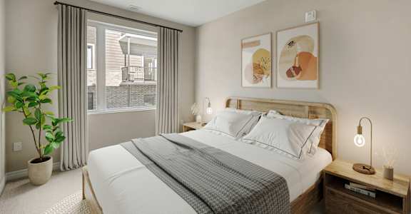A bedroom with a large bed, a potted plant, and a window with curtains.