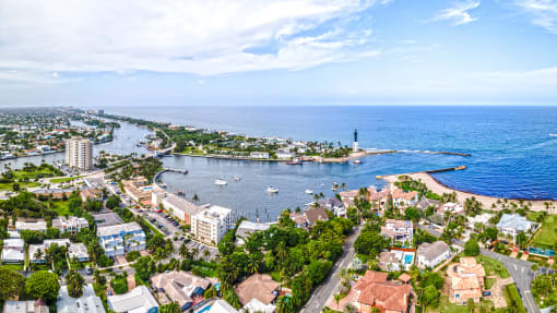 an aerial view of fort lauderdale with a lighthouse in the middle of the harbor