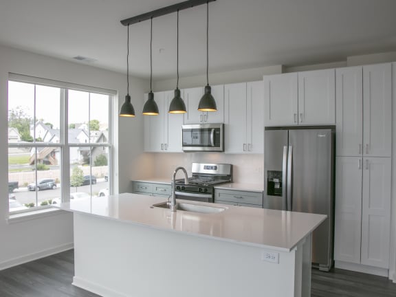 a kitchen with white cabinets and a white counter top at Enclave Crystal Lake Townhomes and Apartments, Crystal Lake, Illinois