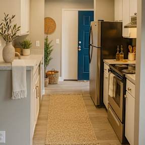 A room with a sliding glass door and a wooden floor.