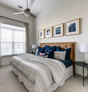 a bedroom with dark green walls and white bedding