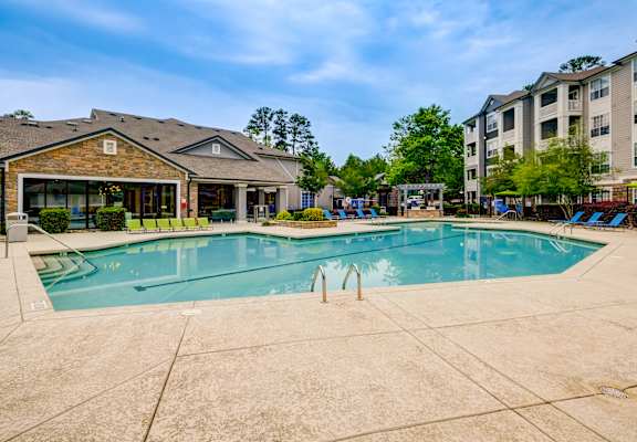 our apartments offer a swimming pool at Crossroads sitting area and fireplace at Centerview at Crossroads, Raleigh, NC
