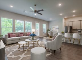 a white kitchen with a marble counter top